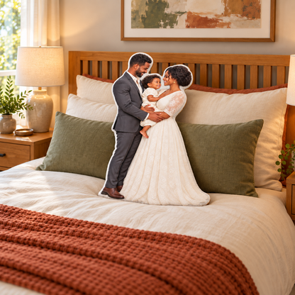 Illustrative Soulmates custom-shaped family pillow on a bedroom bed